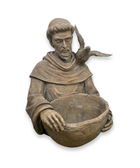 flower arrangement with saint francis statue that doubles as a bird bath